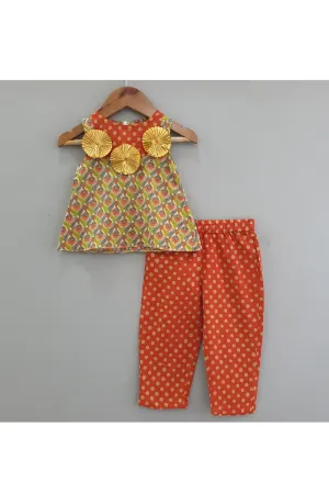 Tangy orange polka dot printed pants with tunic top